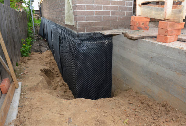 Happy homeowners after waterproofing job in Granville
